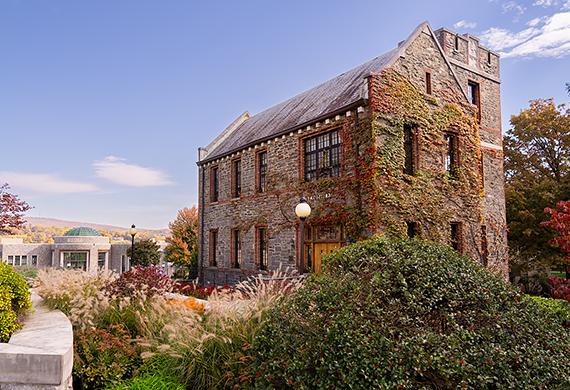 Image of Greystone with Student Center Rotunda in background.